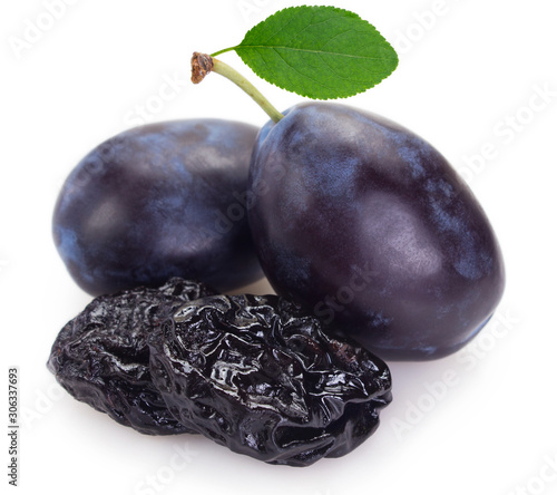Quadro su tela Fresh plums with prunes on white background