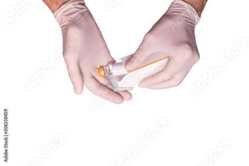 Male doctors hands in rubber gloves holding an ampule of insulin on white backgound isolated. Concept sterility purity, medical clinic, laboratory, glove on the hand of a nurse. Diabetes treatment.