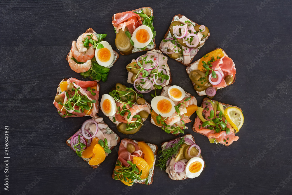 flat lay with danish smorrebrod sandwiches with canned peaches and eggs on grey surface flat lay with danish smorrebrod sandwiches with canned peaches and eggs on grey surface