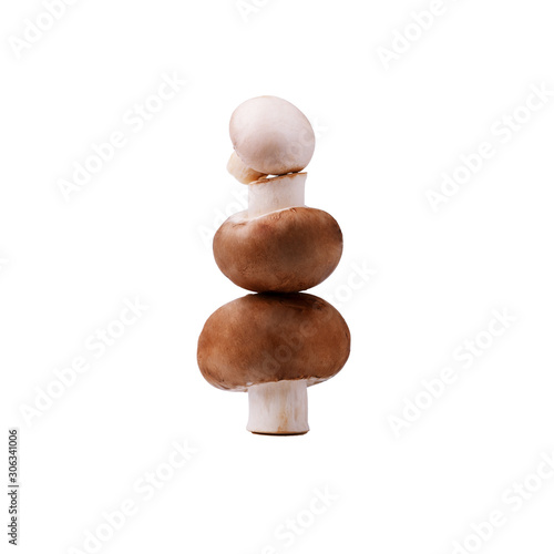 A tower of fresh brown mushrooms isolated on white background