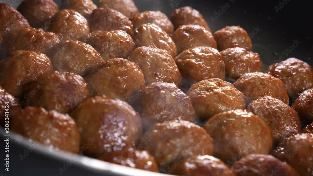 Delicious meatballs in frying pan Delicious meatballs in frying pan