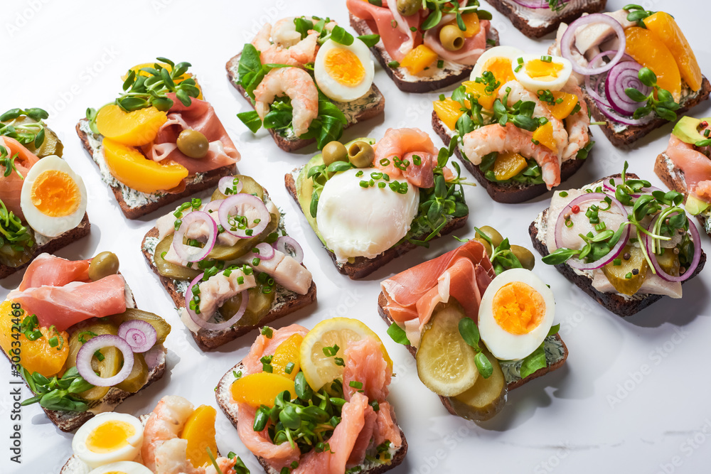danish smorrebrod sandwiches on white marble surface danish smorrebrod sandwiches on white marble surface