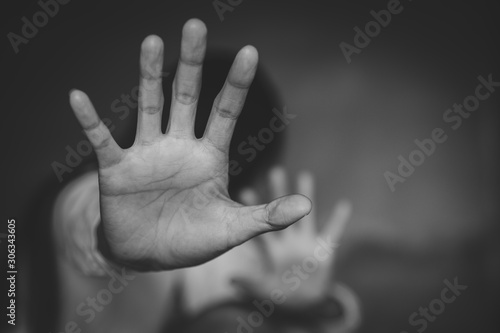 Women  bondage lift hands against violence against women,international women's day. black and white picture..