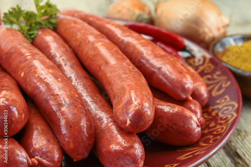 several raw merguez on a plate