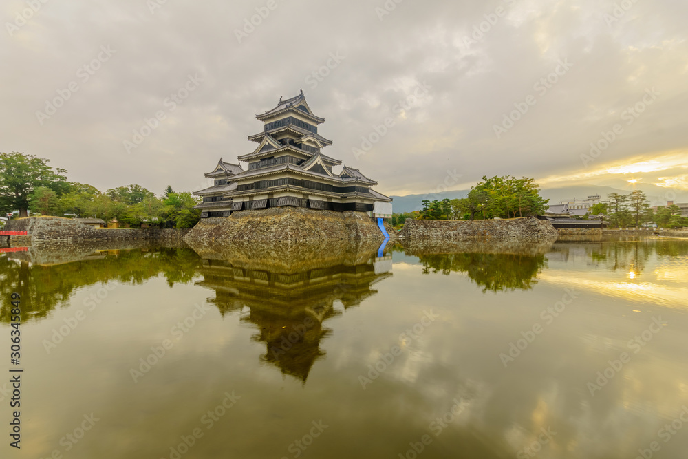 Sunrise view of Matsumoto Castle (Crow Castle) and bridge Sunrise view of Matsumoto Castle (Crow Castle) and bridge