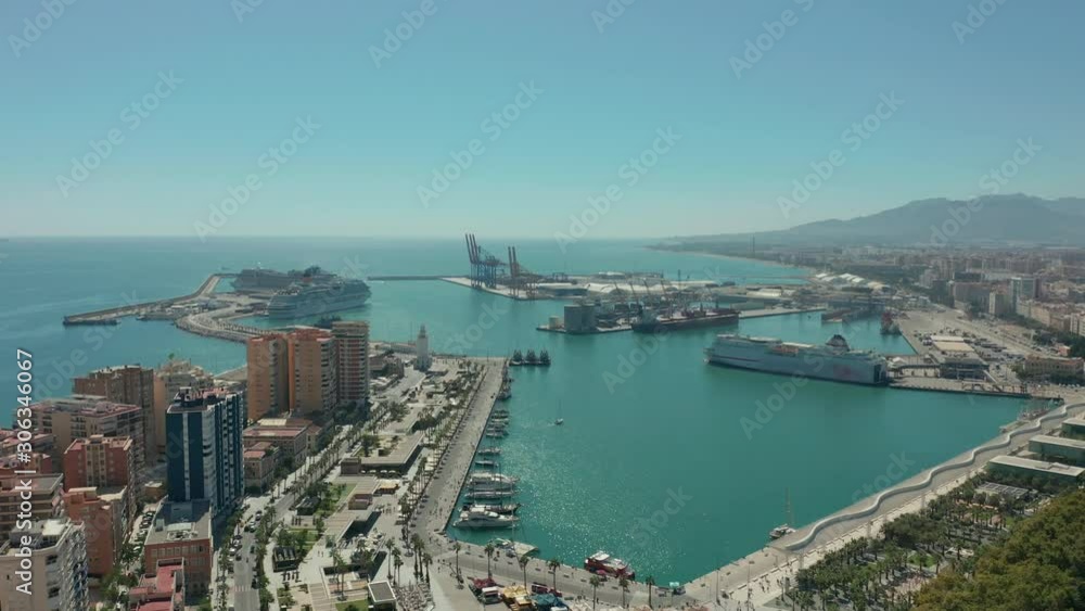 Aerial view. Malaga, Spain. City buildings and seaside view. Ships and port. Aerial view. Malaga, Spain. City buildings and seaside view. Ships and port.