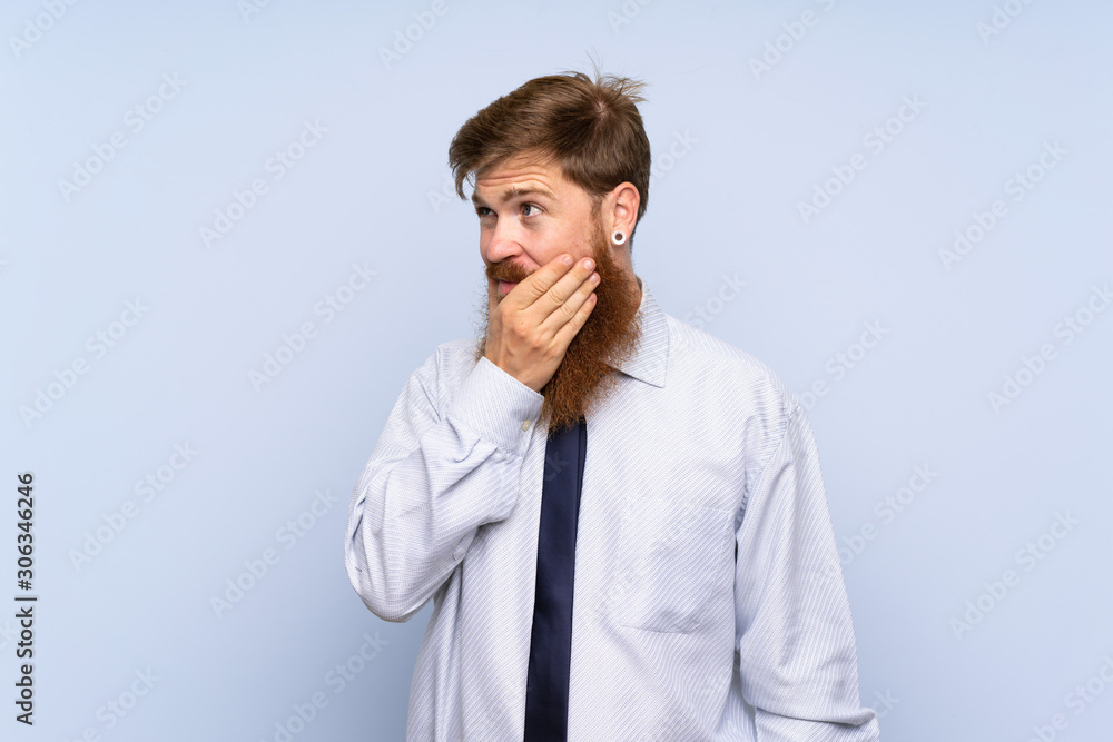 Businessman with long beard over isolated background thinking an idea Businessman with long beard over isolated background thinking an idea