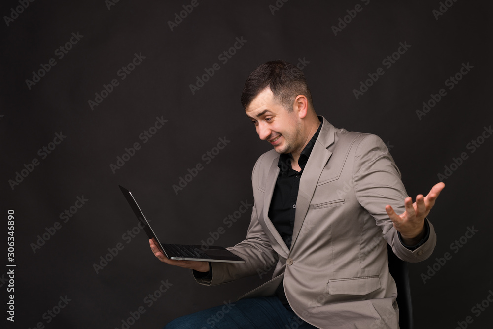 Photo of businessman, talking online with clients and gesturing like he doesn't know Photo of businessman, talking online with clients and gesturing like he doesn't know