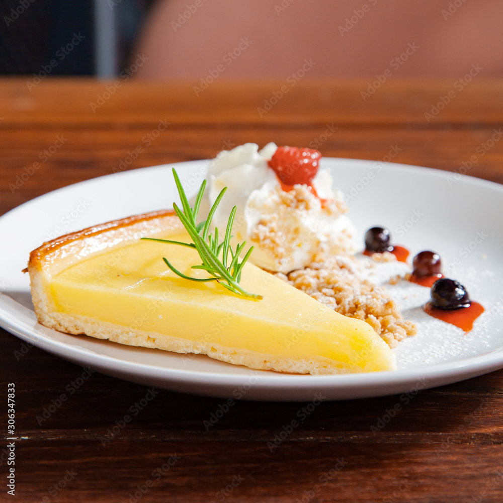 Fresh tasty lemon tart with crumble and whipped cream Fresh tasty lemon tart with crumble and whipped cream