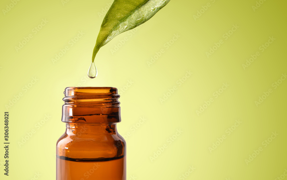 Leaf and drop of natural medicine falling into jar isolated - obrazy, fototapety, plakaty 