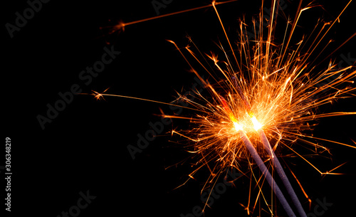 Wallpaper Mural Burning firework sparklers on black background with copy space Torontodigital.ca