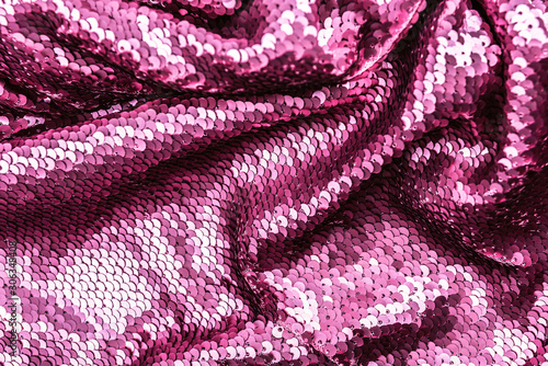 Pink purple shiny fabric with sequins, abstract background.