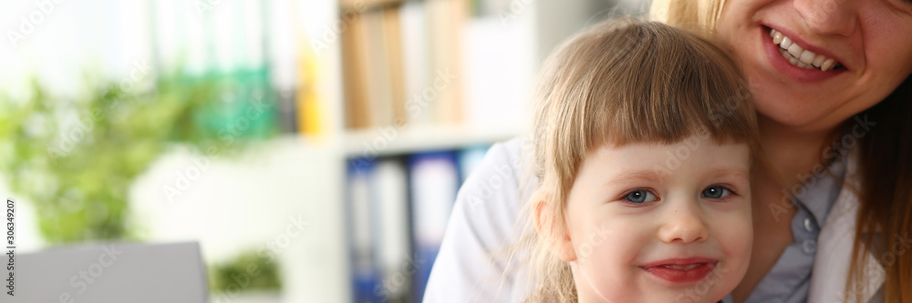 Cute little girl visiting family doctor office