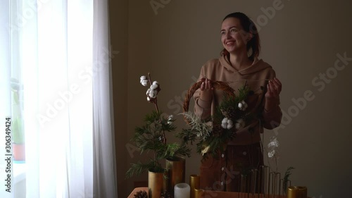 Wallpaper Mural WOman florist making christmas wreath and decoration on christmas table. Happy season. DIY zero waste Torontodigital.ca