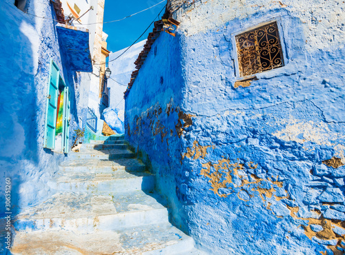 Chefchaouen city street with narrow stairs and blue walls in Morocco © leelook