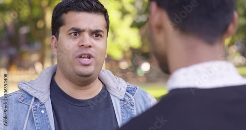 Medium Shot - Indian man argues with another man while at the park - Slow Motion - shot on RED
