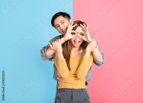 Portrait Of Happy Young Couple playing and dancing