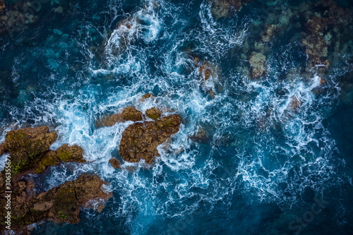 Top view of a deserted coast. Rocky shore of the island of Tenerife. Aerial drone photo of ocean waves reaching shore
