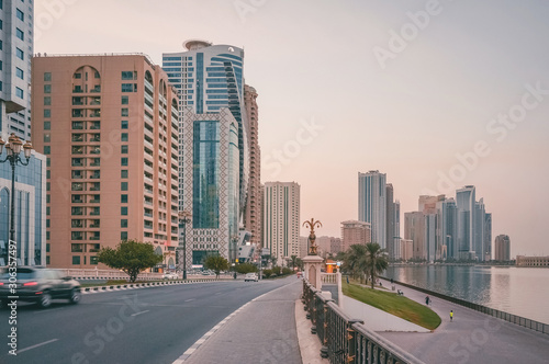 Evening In Sharjah. Cityscape with skyscrapers. UAE. 