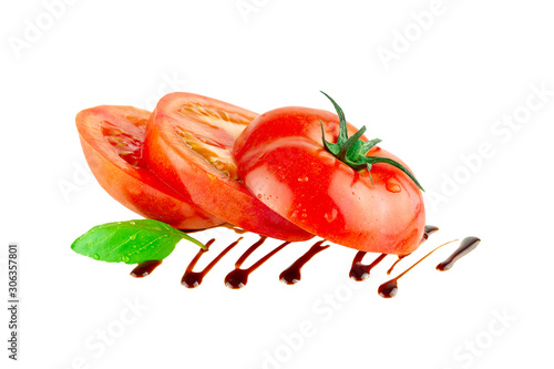 Tomato slices with balsamic vinegar basil leaf  isolated