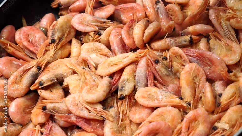 shrimps. Seafood appetizer. Top view. Healthy clean eating diet. Shrimps close-up. adding salt to a dish shrimps. Seafood appetizer. Top view. Healthy clean eating diet. Shrimps close-up. adding salt to a dish