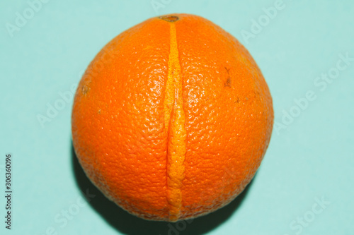 Closeup fresh orange looking like female vagina, vulva symbol. photo