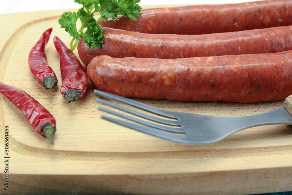 several merguez on a cutting board several merguez on a cutting board