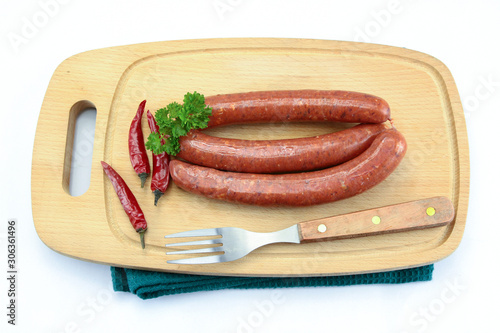 several merguez on a cutting board