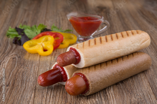 french hot dog with paprika and ketchup