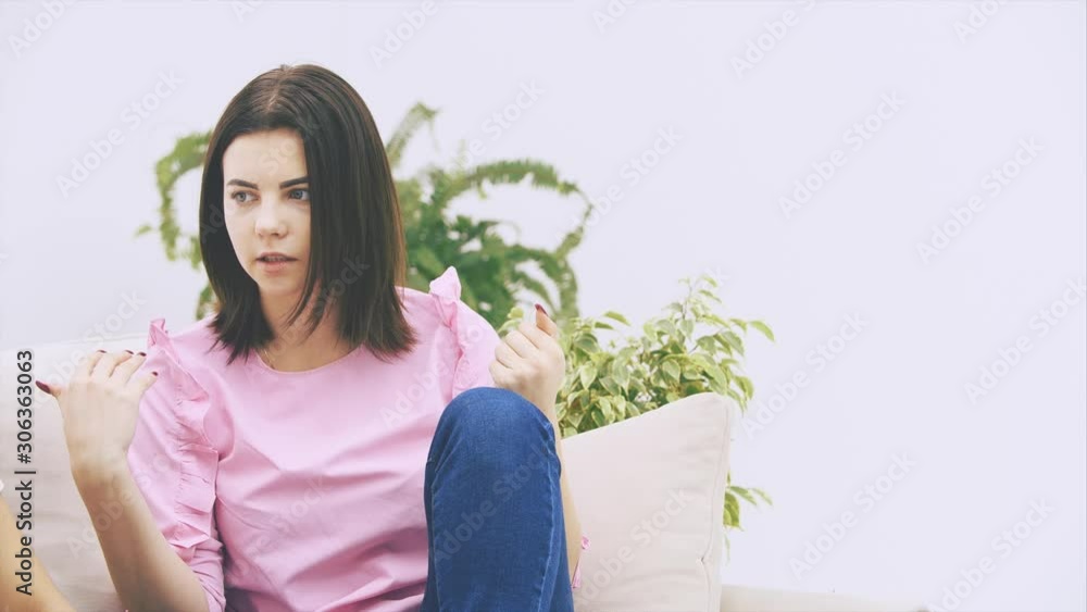Cute caucasian girl is telling her afro-american friend a story, looking serious and worrisome. Cute caucasian girl is telling her afro-american friend a story, looking serious and worrisome.