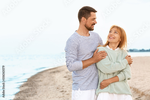 Happy couple resting at sea...