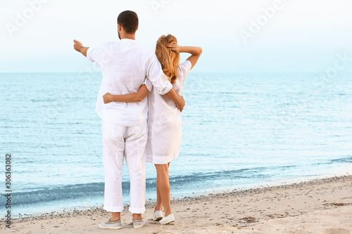 Happy couple resting at sea...