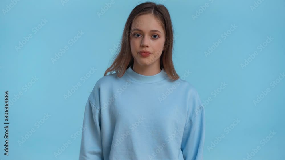teenager pointing with finger and hand isolated on blue teenager pointing with finger and hand isolated on blue