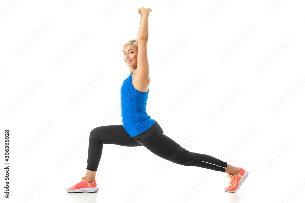 European blonde girl performs physical exercises on a white background