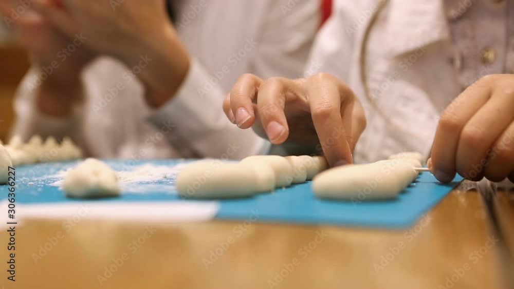 Children's hands are molded from dough Children's hands are molded from dough