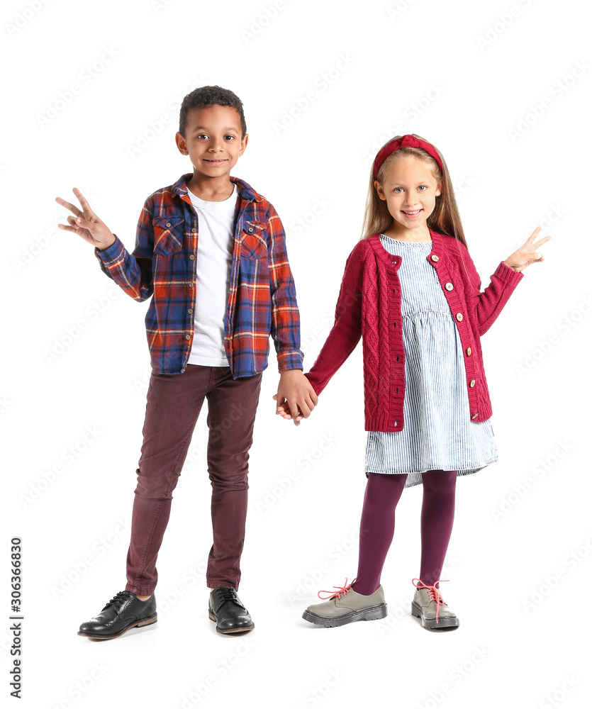 Fashionable little children in autumn clothes on white background