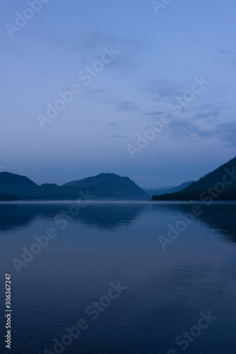 Lake Teletskoye in the mountains. In the evening you can see the hills and nature. Altai region