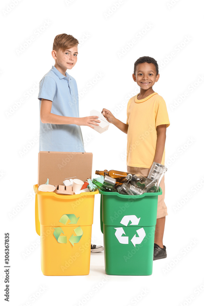 Little boys and containers with trash on white background. Concept of recycling Little boys and containers with trash on white background. Concept of recycling