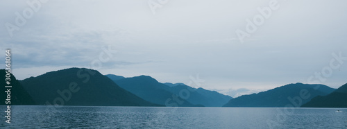 Lake Teletskoye in the mountains. In the evening you can see the hills and nature. Altai region