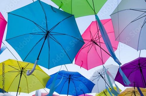 Colorful umbrellas decoration on the clear sky background