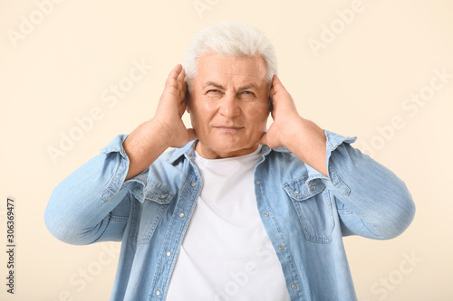 Mature man with hearing pro...