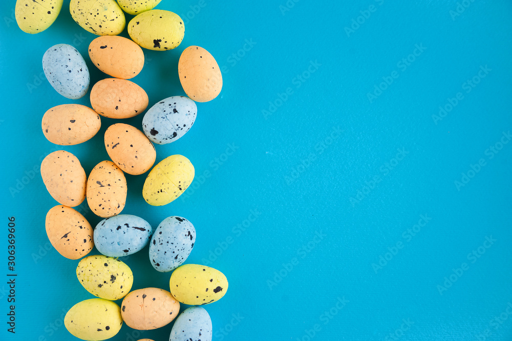 Flat lay pictures for Easter. Miniature eggs on a pink and blue background and copy space. Flat lay pictures for Easter. Miniature eggs on a pink and blue background and copy space.
