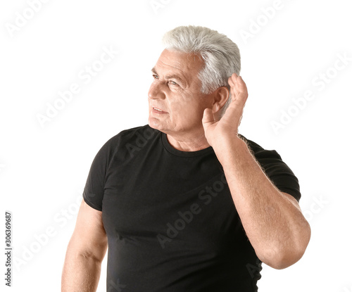 Mature man with hearing pro...
