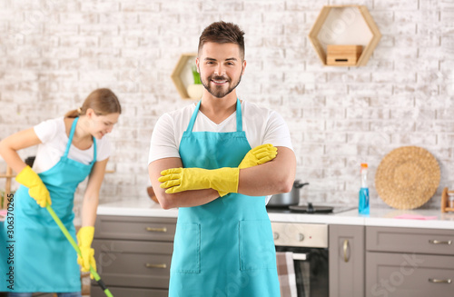 Portrait of male janitor in kitchen