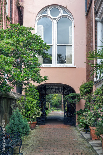 A stone walkway leads to a courtyard in Charleston  South Carolina