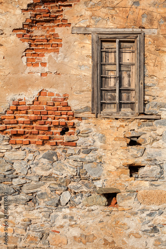 old brick wall with window © izzetugutmen
