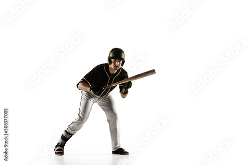 Baseball player, pitcher in a black uniform practicing and training isolated on a white background. Young professional sportsman in action and motion. Healthy lifestyle, sport, movement concept.