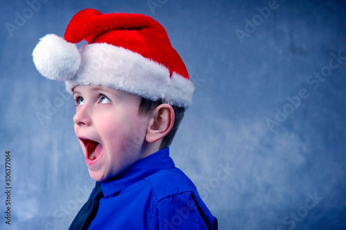 Happy child in a Christmas hat.