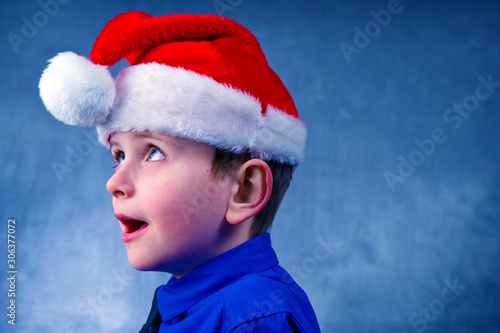 Happy child in a Christmas hat.