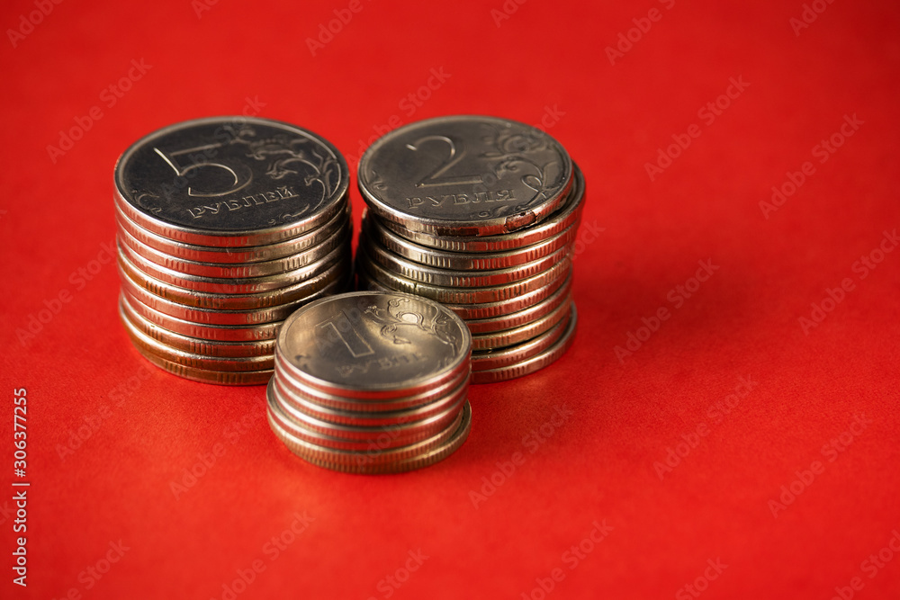 Three columns of ruble coins on red. Three columns of ruble coins on red.